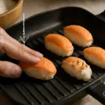 Come evitare che i nigiri si spacchino in cottura? Il segreto della pressione con le dita